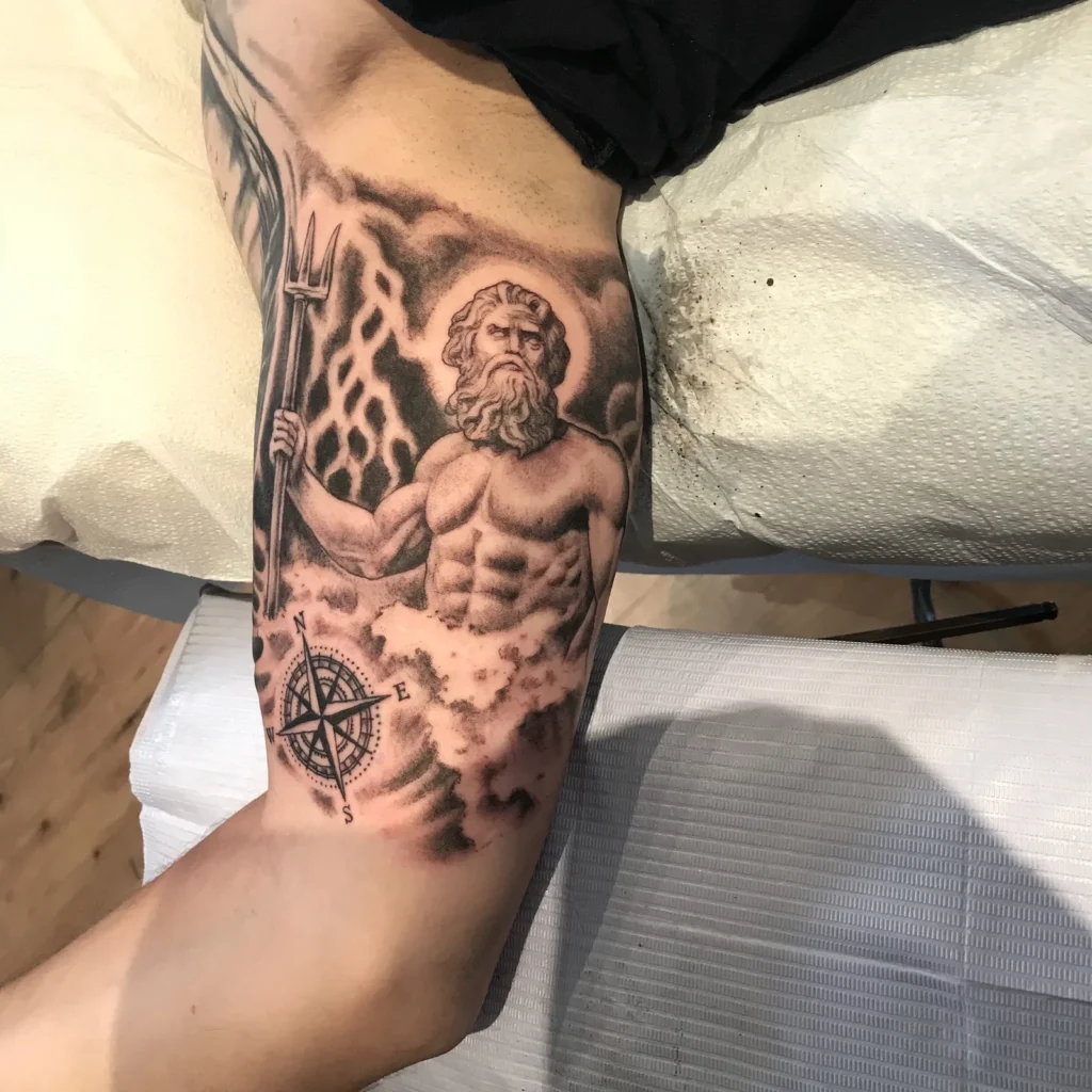 Poseidon holding a trident above a compass rose, black and grey on the inner arm